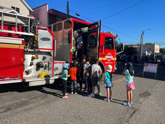 kids exploring fire truck